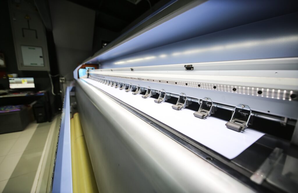 Large format printing machine in operation. Industry